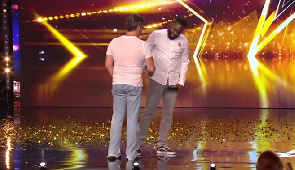 Simon-Cowell-shakes-Kojos-hand-after-giving-him-the-Golden-Buzzer